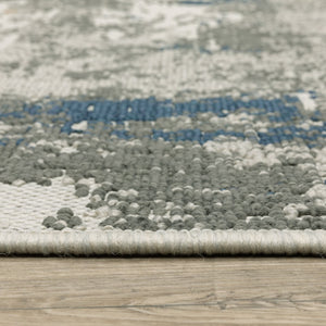 HomeRoots 5' Blue and Beige Abstract Indoor-Outdoor Area Rug - Stain Resistant, Durable, Easy to Clean Design 6'7" x 9'2" 507479