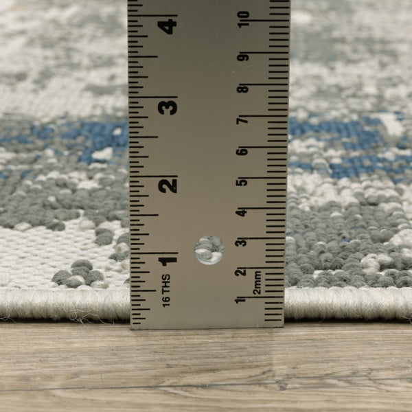 HomeRoots 5' Blue and Beige Abstract Indoor-Outdoor Area Rug - Stain Resistant, Durable, Easy to Clean Design 6'7" x 9'2" 507479