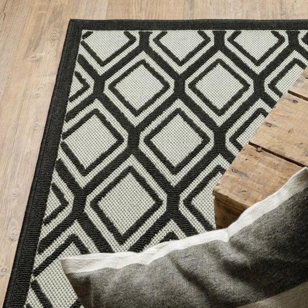 HomeRoots 5' Beige and Black Geometric Area Rug - Stain Resistant, Durable, Perfect for Indoor or Outdoor Use 6'7" x 9'2" 507485