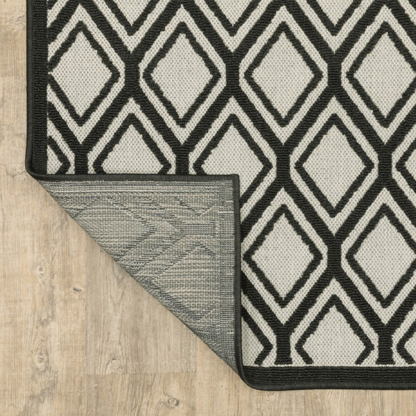 HomeRoots 5' Beige and Black Geometric Area Rug - Stain Resistant, Durable, Perfect for Indoor or Outdoor Use 6'7" x 9'2" 507485
