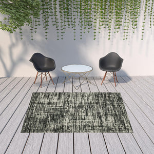 HomeRoots 5' X 7' Distressed Beige and Black Abstract Area Rug – Stain-Resistant for Indoor & Outdoor Use 6'7" x 9'2" 507497