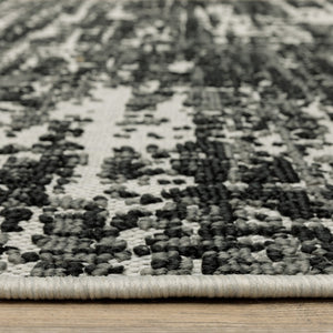 HomeRoots 5' X 7' Distressed Beige and Black Abstract Area Rug – Stain-Resistant for Indoor & Outdoor Use 6'7" x 9'2" 507497