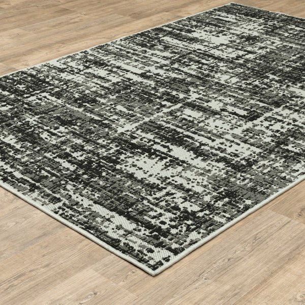 HomeRoots 5' X 7' Distressed Beige and Black Abstract Area Rug – Stain-Resistant for Indoor & Outdoor Use 6'7" x 9'2" 507497