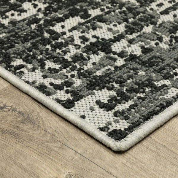 HomeRoots 5' X 7' Distressed Beige and Black Abstract Area Rug – Stain-Resistant for Indoor & Outdoor Use 9'10" x 12'10" 507499
