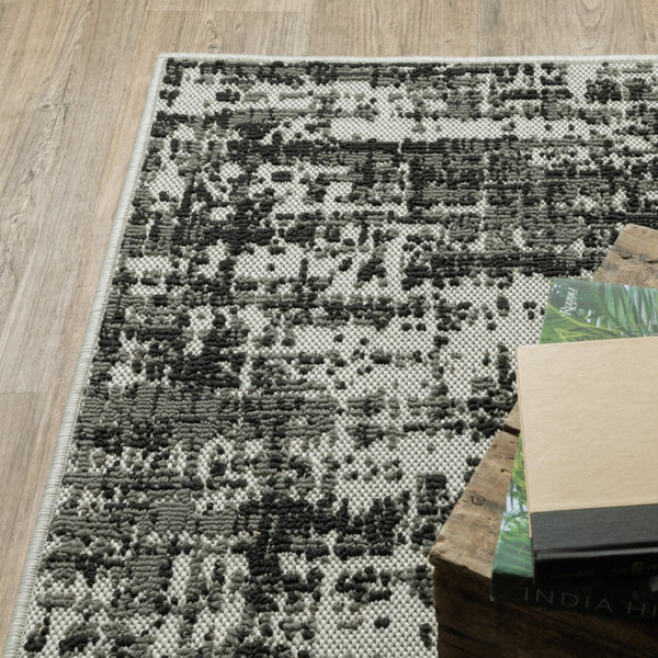 HomeRoots 5' X 7' Distressed Beige and Black Abstract Area Rug – Stain-Resistant for Indoor & Outdoor Use 9'10" x 12'10" 507499