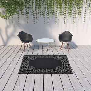 Homeroots 5' X 8' Black And Ivory Stain Resistant Indoor Outdoor Area Rug Black,Ivory Polypropylene 507680