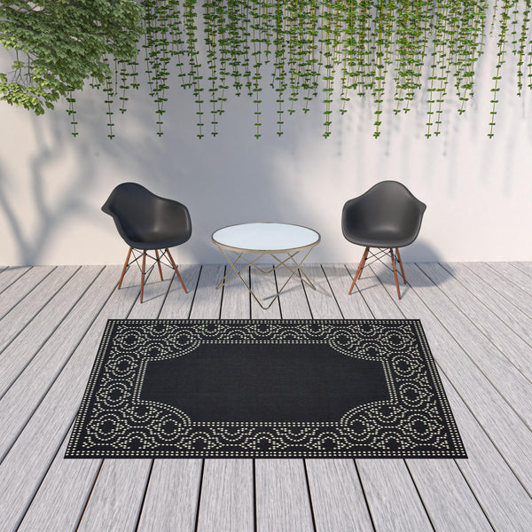 Homeroots 7' X 10' Black And Ivory Stain Resistant Indoor Outdoor Area Rug Black,Ivory Polypropylene 507681
