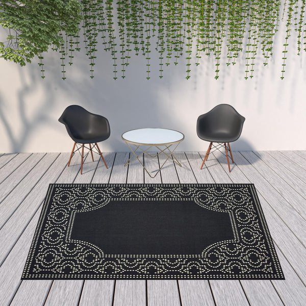Homeroots 8' X 11' Black And Ivory Stain Resistant Indoor Outdoor Area Rug Black,Ivory Polypropylene 507682