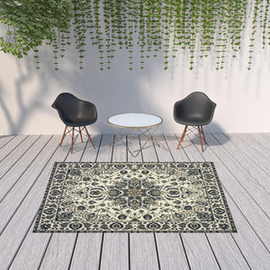 Homeroots 7' X 10' Ivory And Blue Oriental Stain Resistant Indoor Outdoor Area Rug  Polypropylene 507699