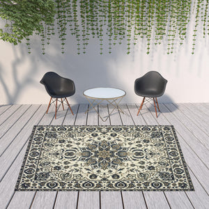 Homeroots 8' X 11' Ivory And Blue Oriental Stain Resistant Indoor Outdoor Area Rug  Polypropylene 507700