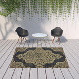 Homeroots 7' X 10' Black And Tan Oriental Stain Resistant Indoor Outdoor Area Rug Black,Tan Polypropylene 507735