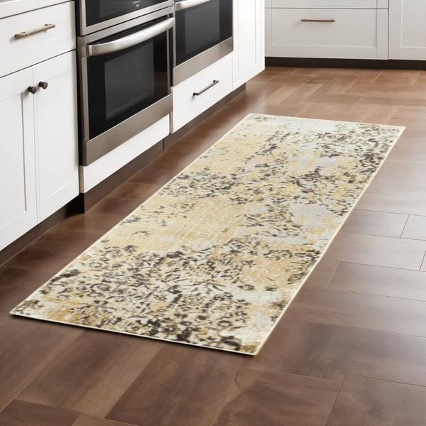HomeRoots 2' Modern Grey and Gold Abstract Power Loom Runner Rug - Stain Resistant, Ideal for High-Traffic Areas 2'3" x 7'6" 508374