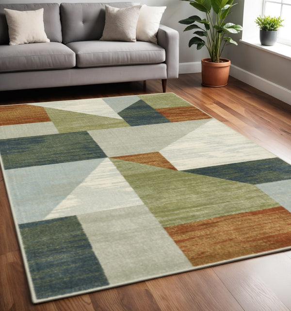 HomeRoots 5' Modern Geometric Power Loomed Area Rug in Grey, Teal Blue, Rust, Green & Ivory for Stylish Spaces 5' X 7' 508407