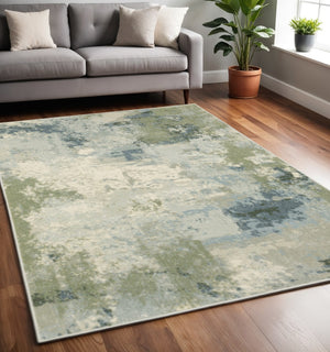 HomeRoots 5' Abstract Power Loom Area Rug in Blue, Green, Grey & Ivory – Stain Resistant for High-Traffic Areas 5' X 7' 508422