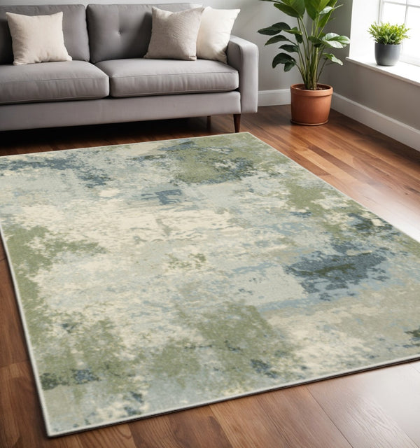 HomeRoots 5' Abstract Power Loom Area Rug in Blue, Green, Grey & Ivory – Stain Resistant for High-Traffic Areas 5' X 7' 508422
