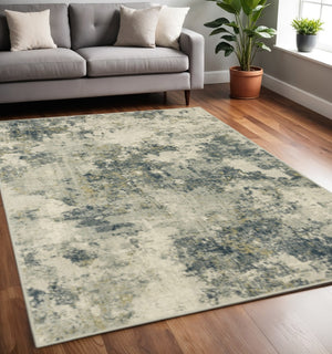 HomeRoots 5' Abstract Area Rug in Beige, Teal, Grey, and Gold - Stain Resistant, Durable, Modern Design for Homes 5' X 7' 508427