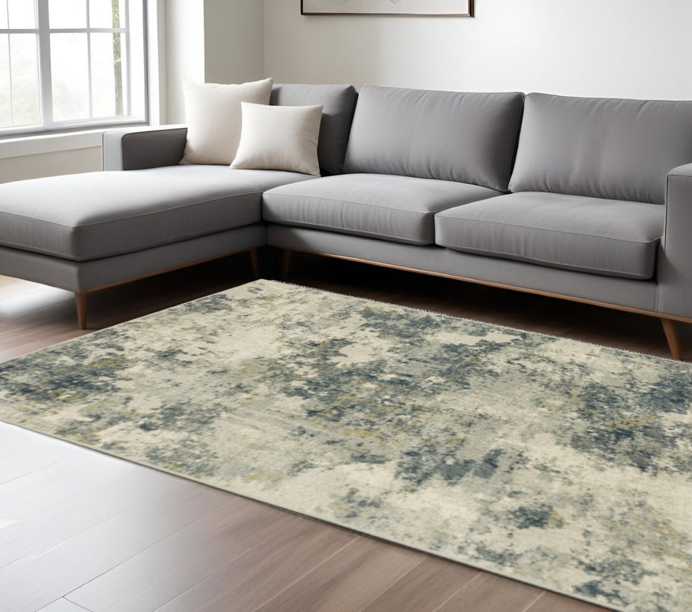 HomeRoots 5' Abstract Area Rug in Beige, Teal, Grey, and Gold - Stain Resistant, Durable, Modern Design for Homes 7' X 9' 508428