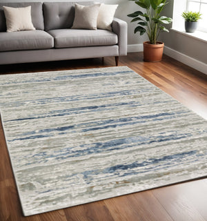 HomeRoots 2' Abstract Power Loom Runner Rug in Grey Blue, Light Blue, Ivory & Brown - Stain Resistant Style 5' X 8' 508780