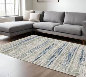 HomeRoots 2' Abstract Power Loom Runner Rug in Grey Blue, Light Blue, Ivory & Brown - Stain Resistant Style 10' X 13' 508782