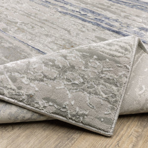 HomeRoots 2' Abstract Power Loom Runner Rug in Grey Blue, Light Blue, Ivory & Brown - Stain Resistant Style 10' X 13' 508782