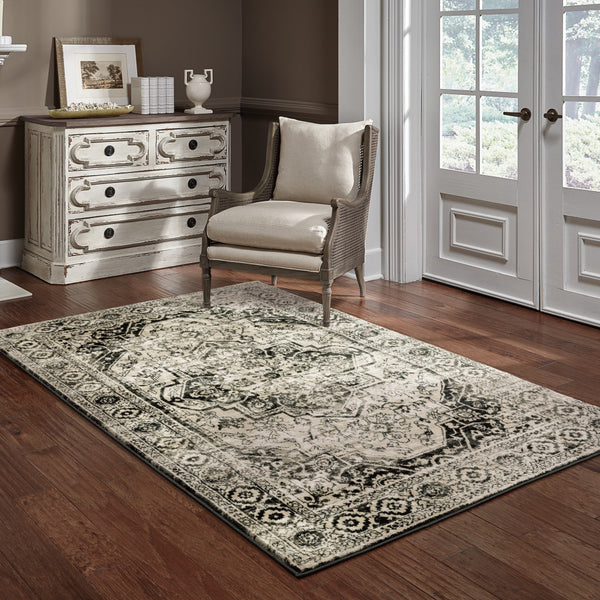 Homeroots 5' X 7' Black Grey Tan And Ivory Oriental Power Loom Stain Resistant Area Rug  Polypropylene 508975