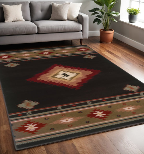 HomeRoots 4' Bold Southwestern Black and Green Power Loom Area Rug - Stain Resistant for High-Traffic Spaces 5' X 8' Rectangle 509035