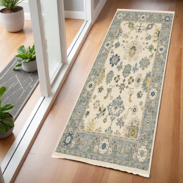 HomeRoots 6' Elegant Oriental Runner Rug in Blue, Ivory, and Red with Fringed Tassels for Hallways Ivory/ Blue 2' x 6' 509353