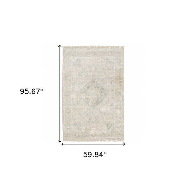 HomeRoots 10' Hand Loomed Beige and Gray Oriental Area Rug - Distressed Design with Fringe for Timeless Elegance 5' X 8' 509455