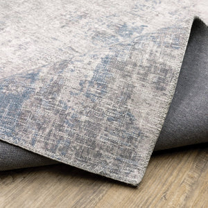 HomeRoots 5' Contemporary Grey and Blue Abstract Power Loom Area Rug - Stain Resistant, Ideal for High-Traffic Spaces 5' X 7' 509510