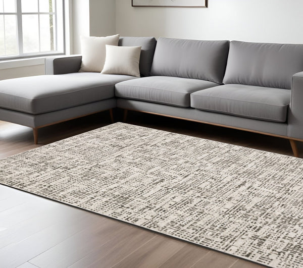 HomeRoots 2' Modern Abstract Power Loom Stain Resistant Runner Rug in Ivory, Grey, Charcoal, and Beige 8' X 11' 509545