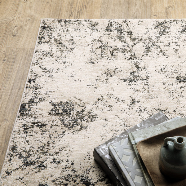 Homeroots 3' X 5' Ivory Grey Black Beige And Tan Abstract Power Loom Stain Resistant Area Rug  Polyester 509554