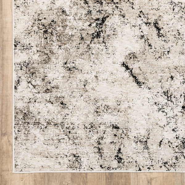 Homeroots 3' X 5' Ivory Grey Black Beige And Tan Abstract Power Loom Stain Resistant Area Rug  Polyester 509554