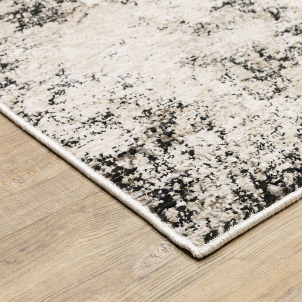Homeroots 5' X 8' Ivory Grey Black Beige And Tan Abstract Power Loom Stain Resistant Area Rug  Polyester 509555