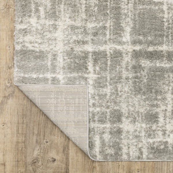 HomeRoots 2' Grey and Ivory Abstract Shag Runner Rug - Stylish, Stain-Resistant, Soft for High-Traffic Areas 2'3" x 7'6" 509878