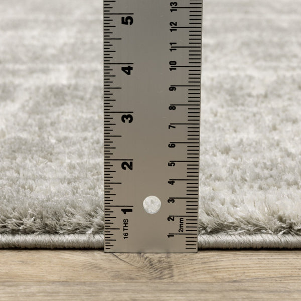 HomeRoots 2' Grey and Ivory Abstract Shag Runner Rug - Stylish, Stain-Resistant, Soft for High-Traffic Areas 2'3" x 7'6" 509878