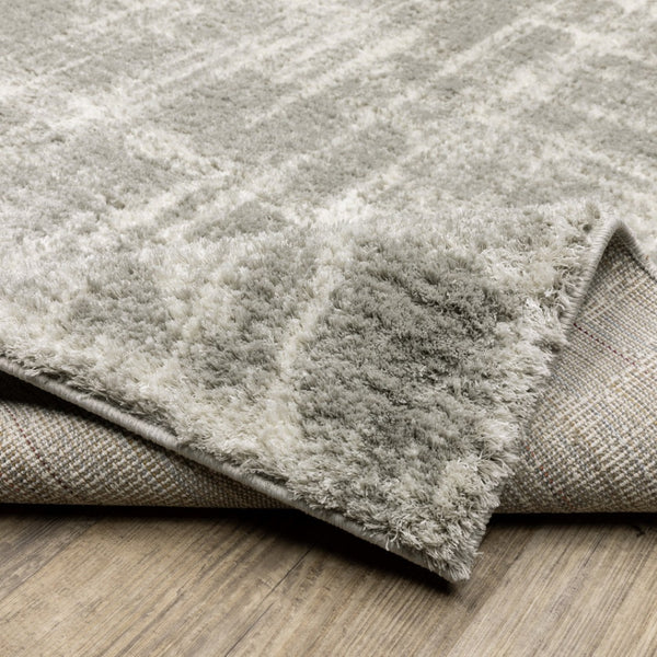 HomeRoots 2' Grey and Ivory Abstract Shag Runner Rug - Stylish, Stain-Resistant, Soft for High-Traffic Areas 7' X 10' 509882