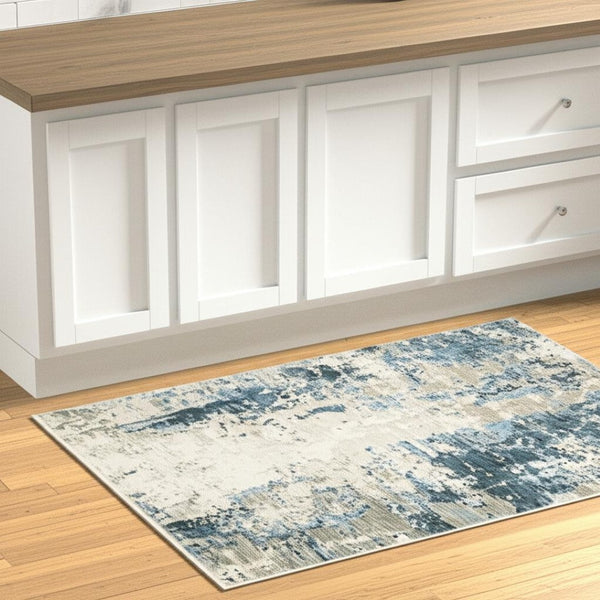 HomeRoots 2' Abstract Power Loom Runner Rug in Blue and Ivory with Stain Resistance and Tassel Fringe Design 2'3" x 7'6" 510291
