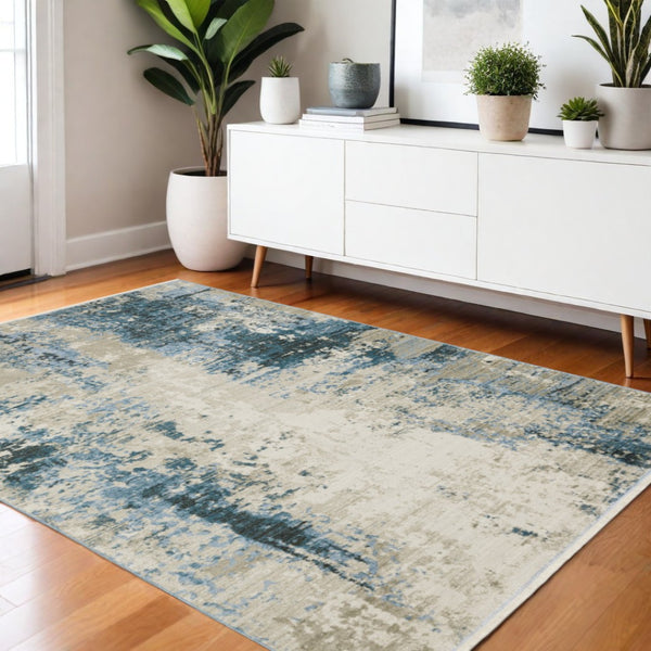 HomeRoots 2' Abstract Power Loom Runner Rug in Blue and Ivory with Stain Resistance and Tassel Fringe Design 4' X 6' 510292