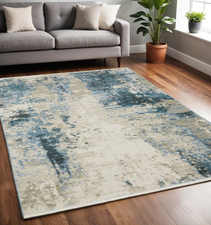 HomeRoots 2' Abstract Power Loom Runner Rug in Blue and Ivory with Stain Resistance and Tassel Fringe Design 5' X 8' 510293