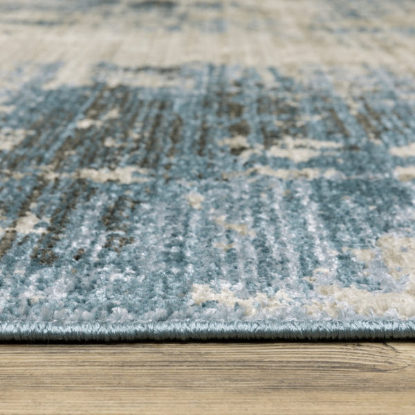 HomeRoots 2' Abstract Power Loom Runner Rug in Blue and Ivory with Stain Resistance and Tassel Fringe Design 5' X 8' 510293