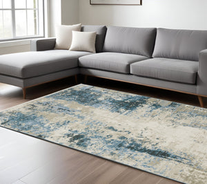 HomeRoots 2' Abstract Power Loom Runner Rug in Blue and Ivory with Stain Resistance and Tassel Fringe Design 8' X 11' 510295