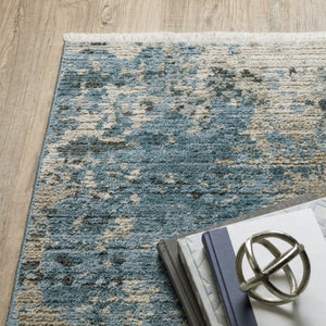 HomeRoots 2' Abstract Power Loom Runner Rug in Blue and Ivory with Stain Resistance and Tassel Fringe Design 8' X 11' 510295