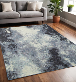 HomeRoots 10' Abstract Blue and Ivory Area Rug – Contemporary Power Loom Design for Modern Living Spaces 5' X 7' 510496