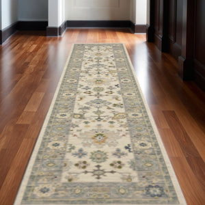 HomeRoots 6' Elegant Oriental Runner Rug in Blue, Ivory, and Red with Fringed Tassels for Hallways Ivory/ Blue 2'6" x 12' 510623