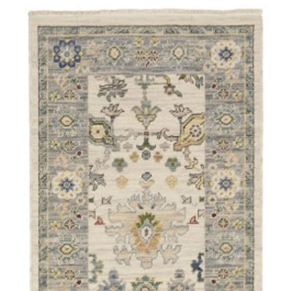 HomeRoots 6' Elegant Oriental Runner Rug in Blue, Ivory, and Red with Fringed Tassels for Hallways Ivory/ Blue 2'6" x 12' 510623