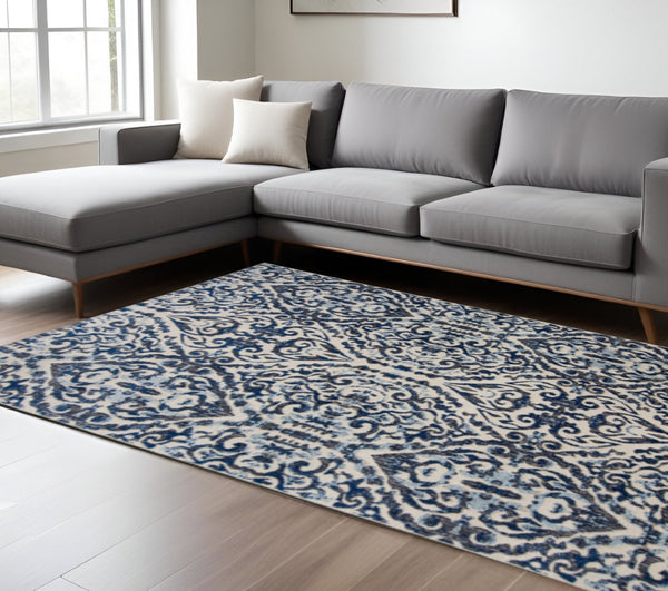 HomeRoots 10' Blue Ivory and Black Floral Distressed Area Rug - Stain Resistant, Perfect for Busy Homes & Decor 10' X 14' 511215