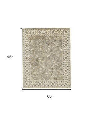 Homeroots 5' X 8' Green Brown And Taupe Wool Paisley Tufted Handmade Stain Resistant Area Rug  Wool 511281