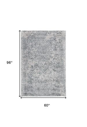 HomeRoots 5' Hand-Woven Blue and Gray Abstract Area Rug for Modern Spaces, Unique Artistry and Durability 5' X 8' 511325
