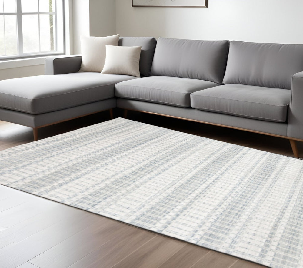 HomeRoots 7' Hand-Woven Ivory and Blue Striped Area Rug – Coastal Charm for Modern and Transitional Spaces 7' X 9' 511451