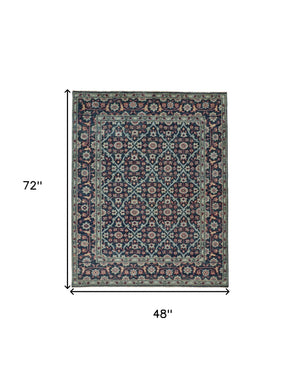 Homeroots 4' X 6' Blue And Green Wool Floral Hand Knotted Distressed Area Rug With Fringe  Wool 511636